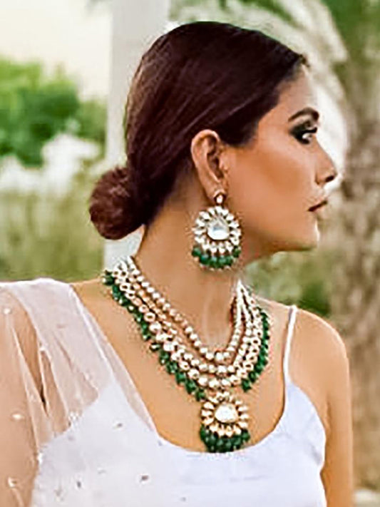 Pooja Raina in Kundan layered Necklace with Green Hangings.