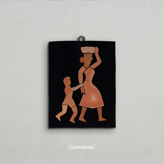 Following The Motherhood Terracotta Wall Hanging